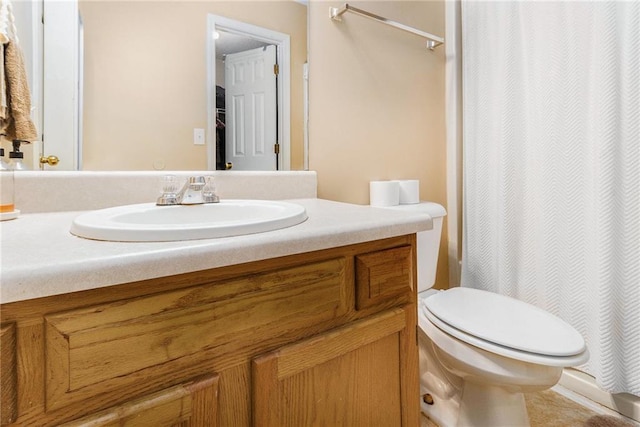 full bathroom with toilet, vanity, and a shower with curtain