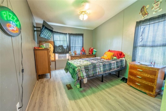 735 Hale Rd, Maysville, GA 30558 - bedroom with wood finished floors and a textured ceiling