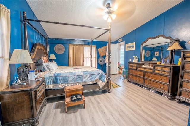 735 Hale Rd, Maysville, GA 30558 - bedroom featuring a textured ceiling, wood finished floors, and vaulted ceiling