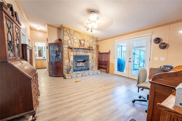 735 Hale Rd, Maysville, GA 30558 - office space with crown molding, french doors, a textured ceiling, wood finished floors, and a stone fireplace