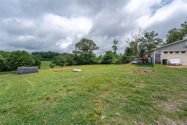 735 Hale Rd, Maysville, GA 30558 - view of grassy yard with a garage