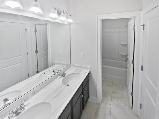 bathroom with vanity, tile patterned flooring, and tub / shower combination