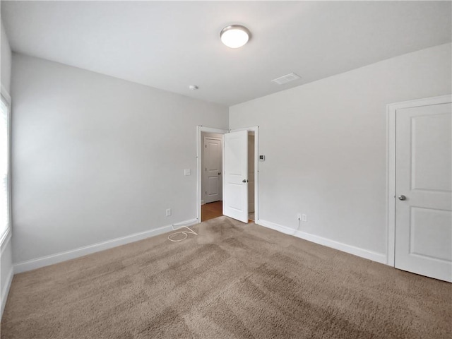 unfurnished bedroom with carpet flooring