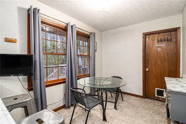 5843 Foxfield Trl, Rex, GA 30273 - dining area with a textured ceiling and baseboards