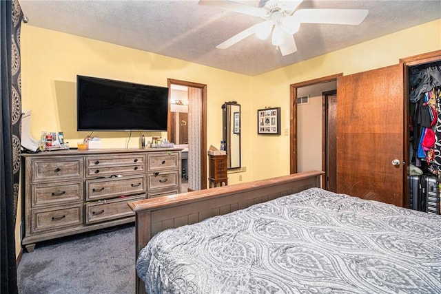 5843 Foxfield Trl, Rex, GA 30273 - bedroom with carpet, a textured ceiling, a closet, and a ceiling fan