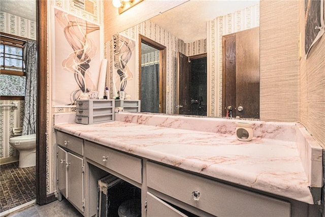 5843 Foxfield Trl, Rex, GA 30273 - bathroom featuring wallpapered walls, toilet, and vanity