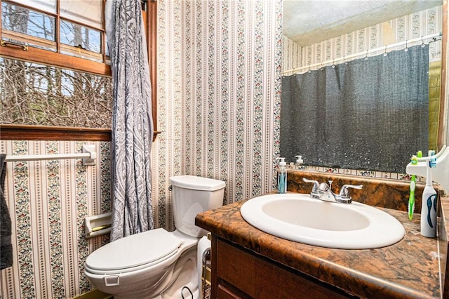 5843 Foxfield Trl, Rex, GA 30273 - half bathroom with wallpapered walls, toilet, and vanity