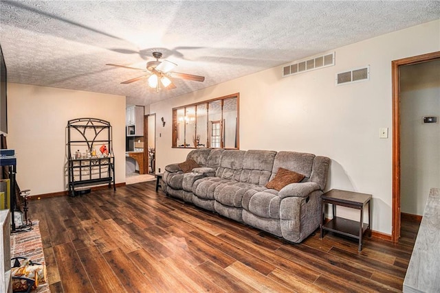 5843 Foxfield Trl, Rex, GA 30273 - living room featuring ceiling fan, wood finished floors, a textured ceiling, and baseboards
