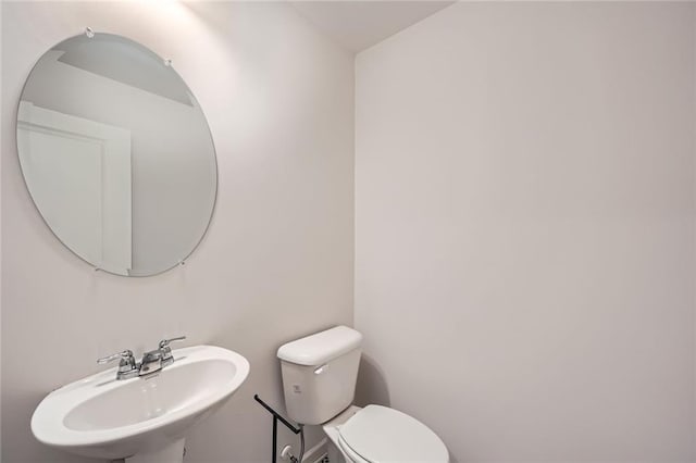 bathroom with a sink and toilet