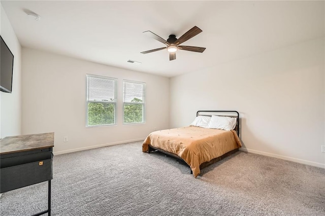 bedroom with visible vents, carpet, baseboards, and a ceiling fan