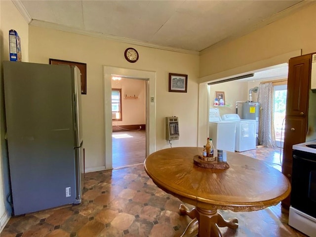 505 Sandhill Hickory Level Rd, Carrollton, GA 30116 - dining room with washing machine and dryer, heating unit, ornamental molding, tile patterned floors, and water heater