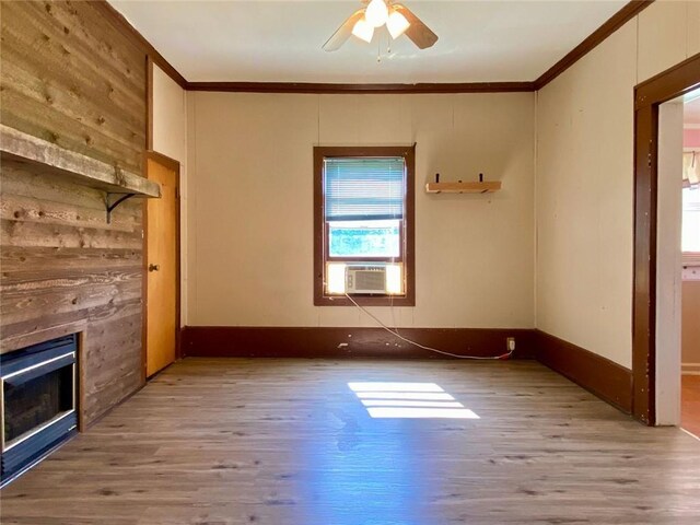 505 Sandhill Hickory Level Rd, Carrollton, GA 30116 - unfurnished living room featuring ornamental molding, wood finished floors, a ceiling fan, and a fireplace