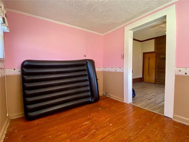 505 Sandhill Hickory Level Rd, Carrollton, GA 30116 - unfurnished room featuring ornamental molding, wood finished floors, a textured ceiling, and baseboards