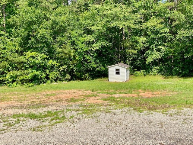 505 Sandhill Hickory Level Rd, Carrollton, GA 30116 - view of yard with a storage shed and an outdoor structure