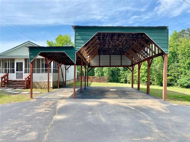 505 Sandhill Hickory Level Rd, Carrollton, GA 30116 - view of home's community with asphalt driveway, a carport, and a lawn