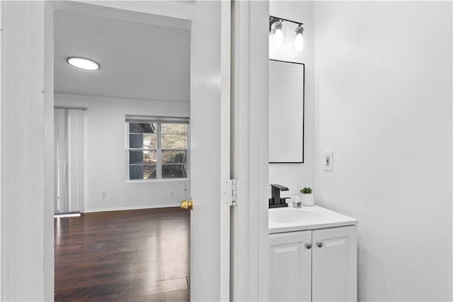 bathroom featuring vanity and hardwood / wood-style floors