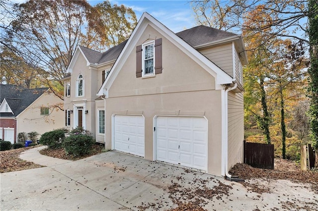 view of side of home with a garage