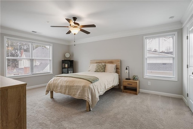 carpeted bedroom with crown molding and ceiling fan