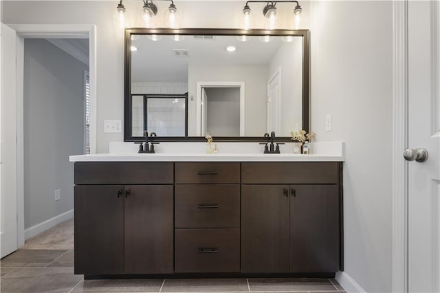 bathroom featuring vanity and an enclosed shower