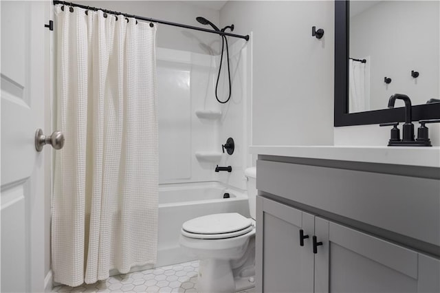 full bathroom featuring vanity, tile patterned floors, toilet, and shower / bath combo with shower curtain