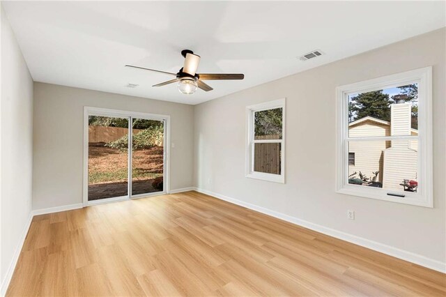 unfurnished room featuring ceiling fan and light hardwood / wood-style floors