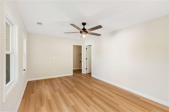 unfurnished room featuring light hardwood / wood-style floors and ceiling fan