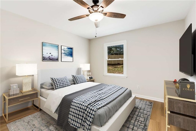 bedroom featuring ceiling fan and wood-type flooring