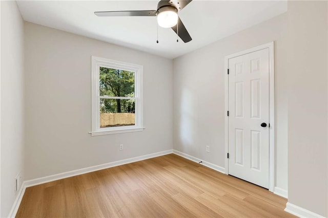 spare room with ceiling fan and light hardwood / wood-style flooring