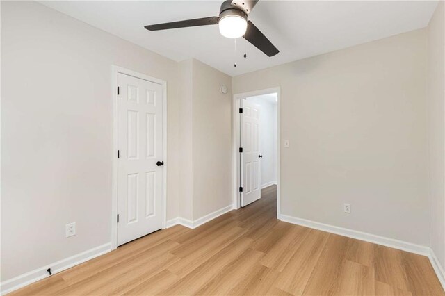 unfurnished bedroom with light hardwood / wood-style floors and ceiling fan