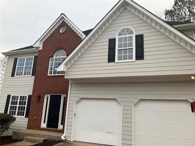 view of front of property with a garage