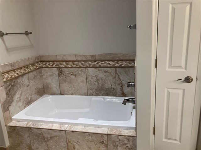 bathroom featuring a relaxing tiled tub