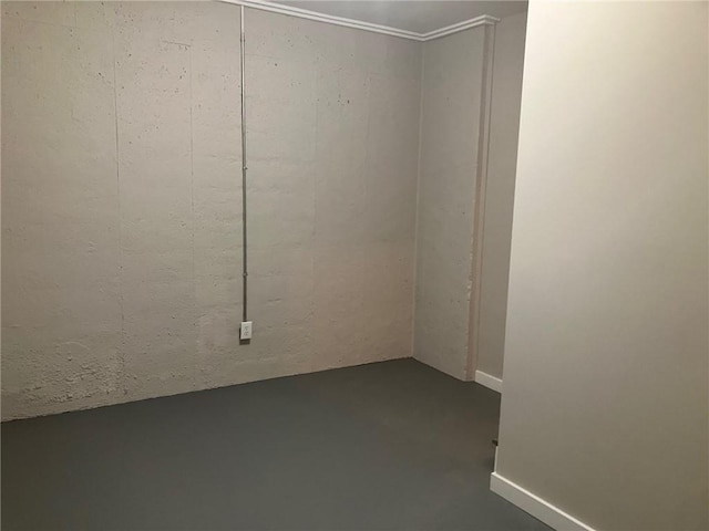 empty room with concrete flooring