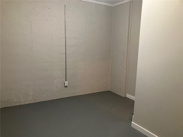 unfurnished room featuring concrete floors