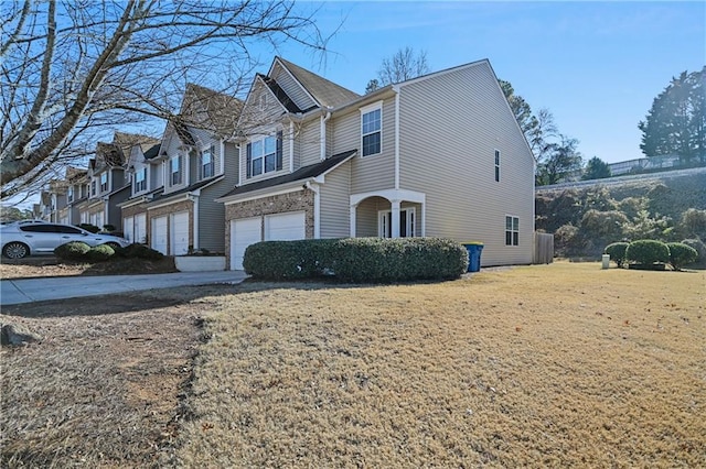 view of home's exterior with a garage and a lawn