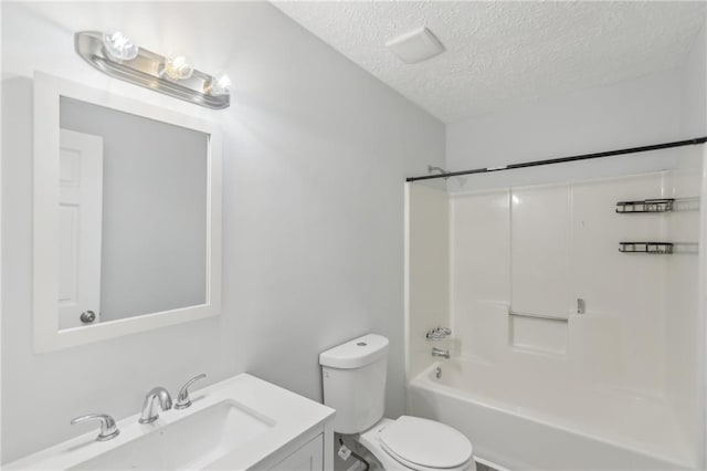 full bathroom with toilet, vanity, bathtub / shower combination, and a textured ceiling