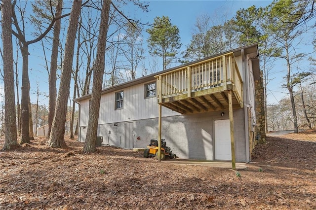 back of property with a wooden deck