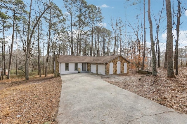 ranch-style house featuring a garage