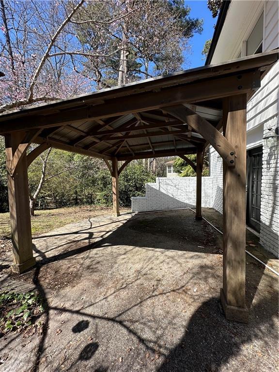 exterior space with a carport