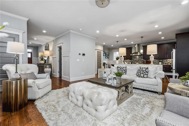 living room with crown molding and dark hardwood / wood-style floors