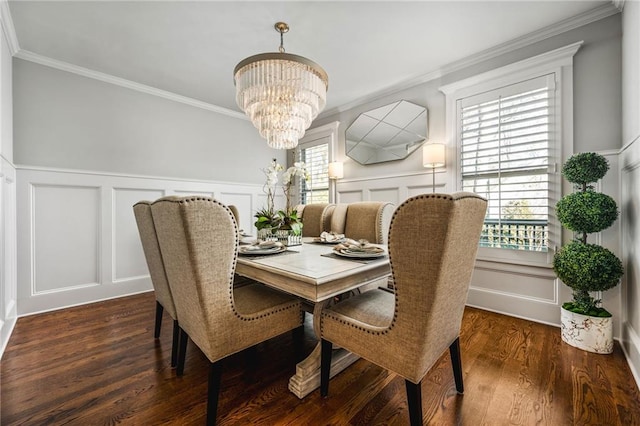 dining space with a chandelier, a wealth of natural light, and ornamental molding