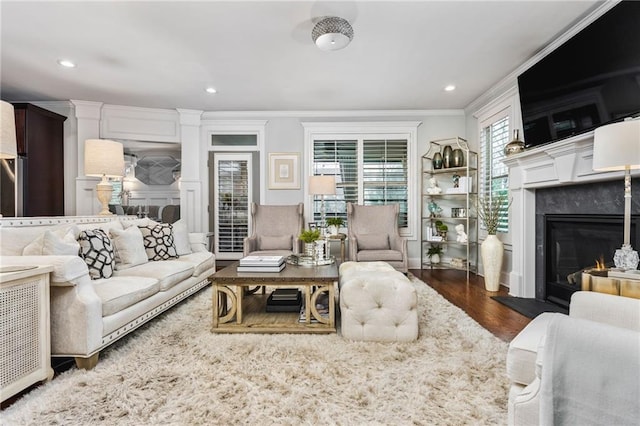 living room with ornamental molding and dark wood-type flooring