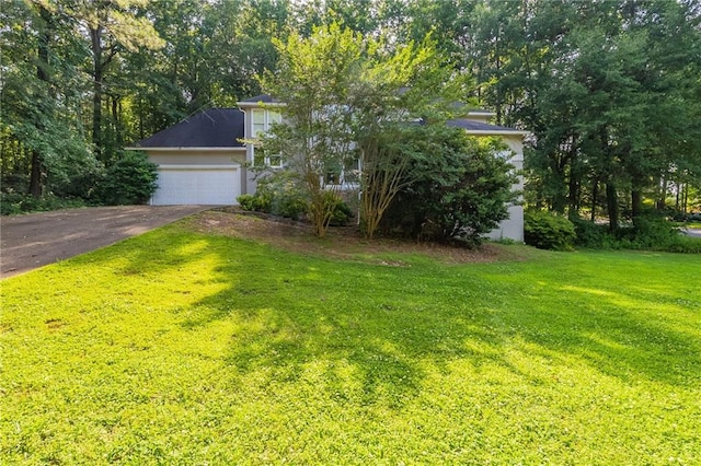 402 John Tate Rd NW, Acworth, GA 30102 - view of front facade with a front yard, driveway, and an attached garage