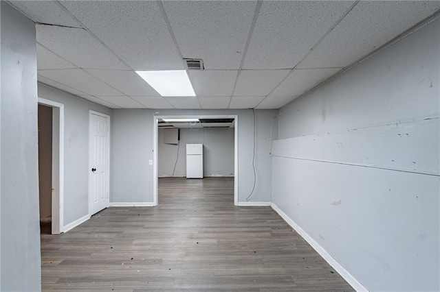 402 John Tate Rd NW, Acworth, GA 30102 - finished basement with freestanding refrigerator, wood finished floors, and a drop ceiling