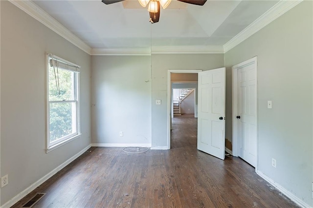 402 John Tate Rd NW, Acworth, GA 30102 - unfurnished room with a ceiling fan, healthy amount of natural light, dark wood-style flooring, ornamental molding, and stairs
