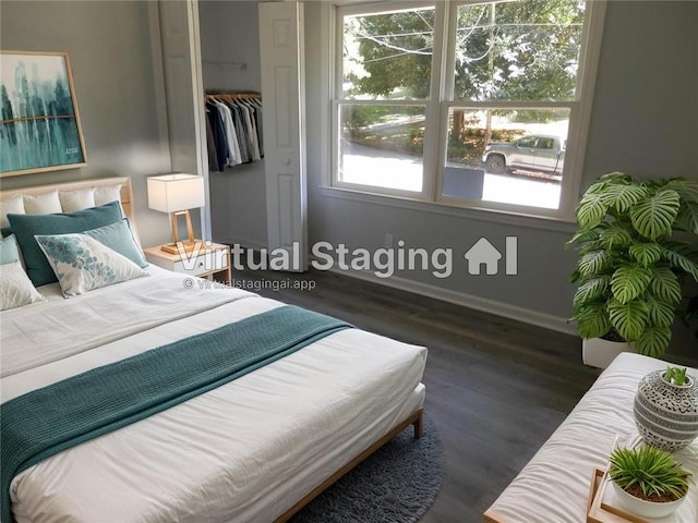 257 E Simon Ter NW, Atlanta, GA 30318 - bedroom with baseboards, wood finished floors, and a closet