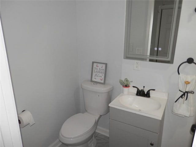 257 E Simon Ter NW, Atlanta, GA 30318 - half bath featuring toilet, baseboards, and vanity
