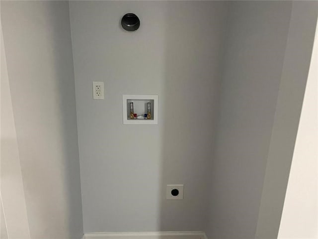 257 E Simon Ter NW, Atlanta, GA 30318 - clothes washing area with baseboards, laundry area, electric dryer hookup, and hookup for a washing machine