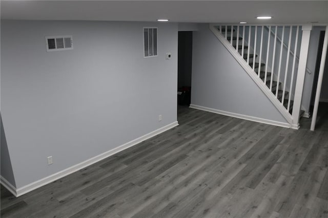 257 E Simon Ter NW, Atlanta, GA 30318 - finished basement with stairway, baseboards, dark wood finished floors, and visible vents