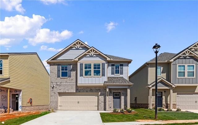 craftsman-style house featuring a front yard and a garage