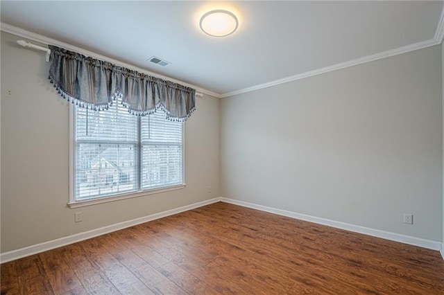 unfurnished room with hardwood / wood-style flooring and crown molding